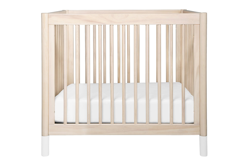 M12998NXW, Gelato 2-in-1 Mini Crib in Washed Natural with White Feet at front